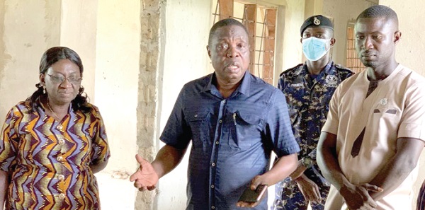 Kwasi Adu-Gyan (middle), Bono East Regional Minister, inspecting one of the buildings being constructed to provide office accommodation to officials of decentralised public institutions in the region